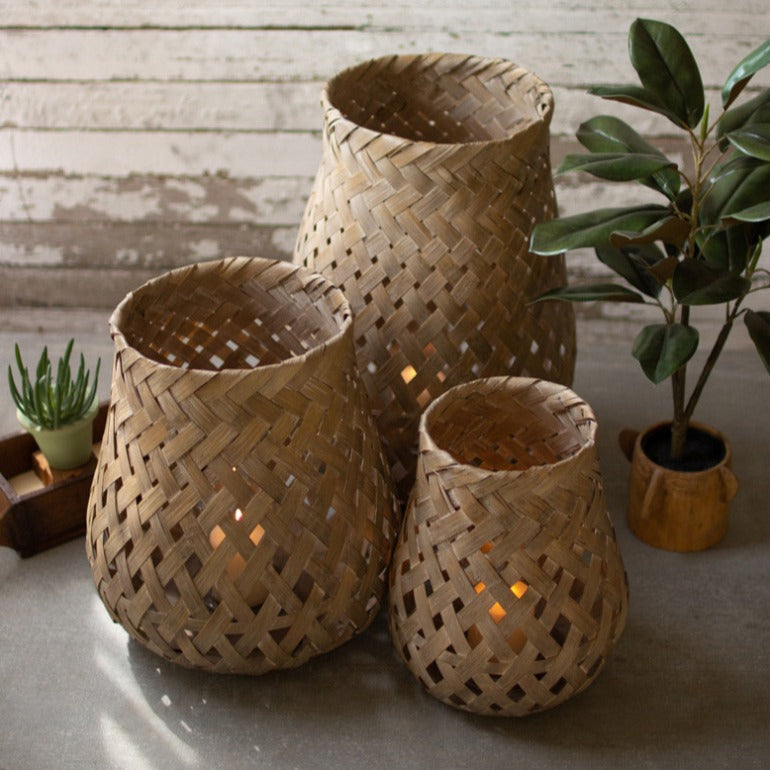 set of three wicker basket lanterns | candle holders | outdoor decor | farmhouse boho decor | beach decor | shop a dash of casual furniture, home décor, kitchenware, gifts, and art online or in store | Located inside the Corner Cartel in Boerne | best boerne shops for home decor vintage items accessories and gifts