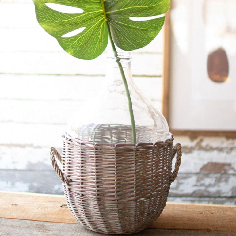 clear glass damigiana with gray wicker wrap | demijohn demi john | farmhouse decor | shop a dash of casual home decor and gifts online or in store | Located inside the Corner Cartel in Boerne | best boerne shops for home decor vintage items accessories and gifts